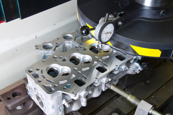 Illustrative example of cylinder head resurfacing machine from Google Search